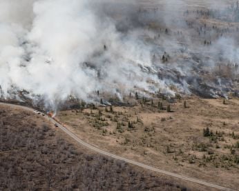 Firefighters implement a prescribed burn near Burwash Landing in 2023.