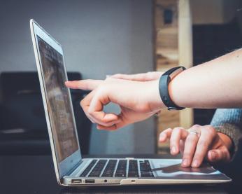 People collaborating on a computer