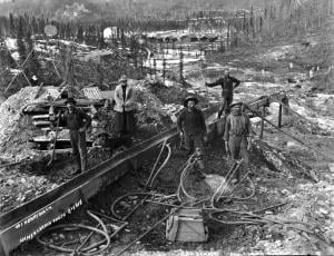 Historical photo of miners on creek