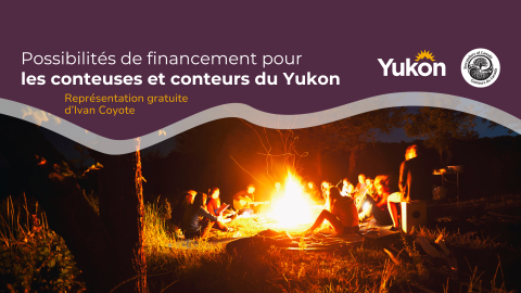 Group of people sitting around campfire