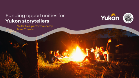 Group of people sitting around campfire