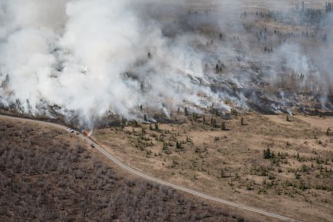 Firefighters implement a prescribed burn near Burwash Landing in 2023.