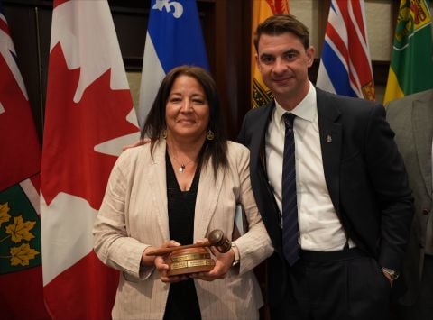 Minister of Community Services Cory Bellmore receives the chair’s gavel from Alberta Minister of Municipal Affairs Dan Williams. The Yukon will host next years meeting of provincial and territorial Ministers responsible for local Government. 