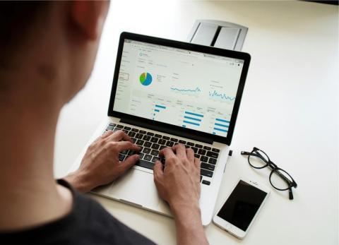 View of a laptop with charts displayed