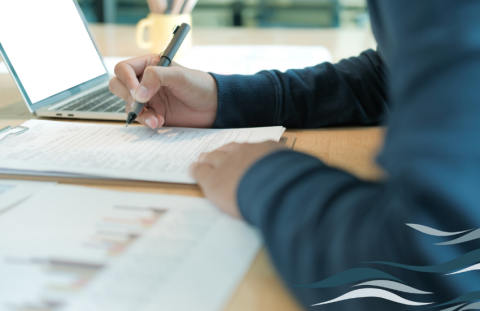 generic person's hands filling out an application