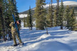 John Minder emptying snow tube at Russell Lake. Photo credit: A. Mischler