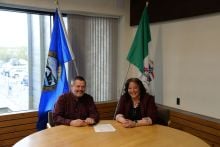 Mayor Kirk Cameron and Minister Cory Bellmore sign joint funding request letter to Minister Gregor Robertson.