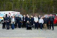 Dr. Tim Black, National Clinical Director, Wounded Warriors Canada, Minister of Community Services Cory Bellmore,  Minister of Health and Social Services Brad Cathers , Wendy Hafemeister Director of Wildland Fire Management, Greg Blackjack Director of Emergency Measures Organization and Devin Bailey Chief of Emergency Medical Services, pose alongside members of the Emergency Services units. The announcement of the the expansion of the partnership between the Government of Yukon and Wounded Warriors Canada t