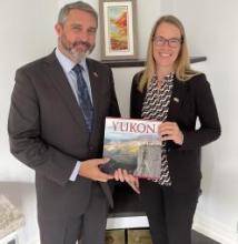 Premier Silver gifting Ambassador Menzies a book.