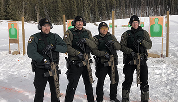 Conservation officers at the rifle range.