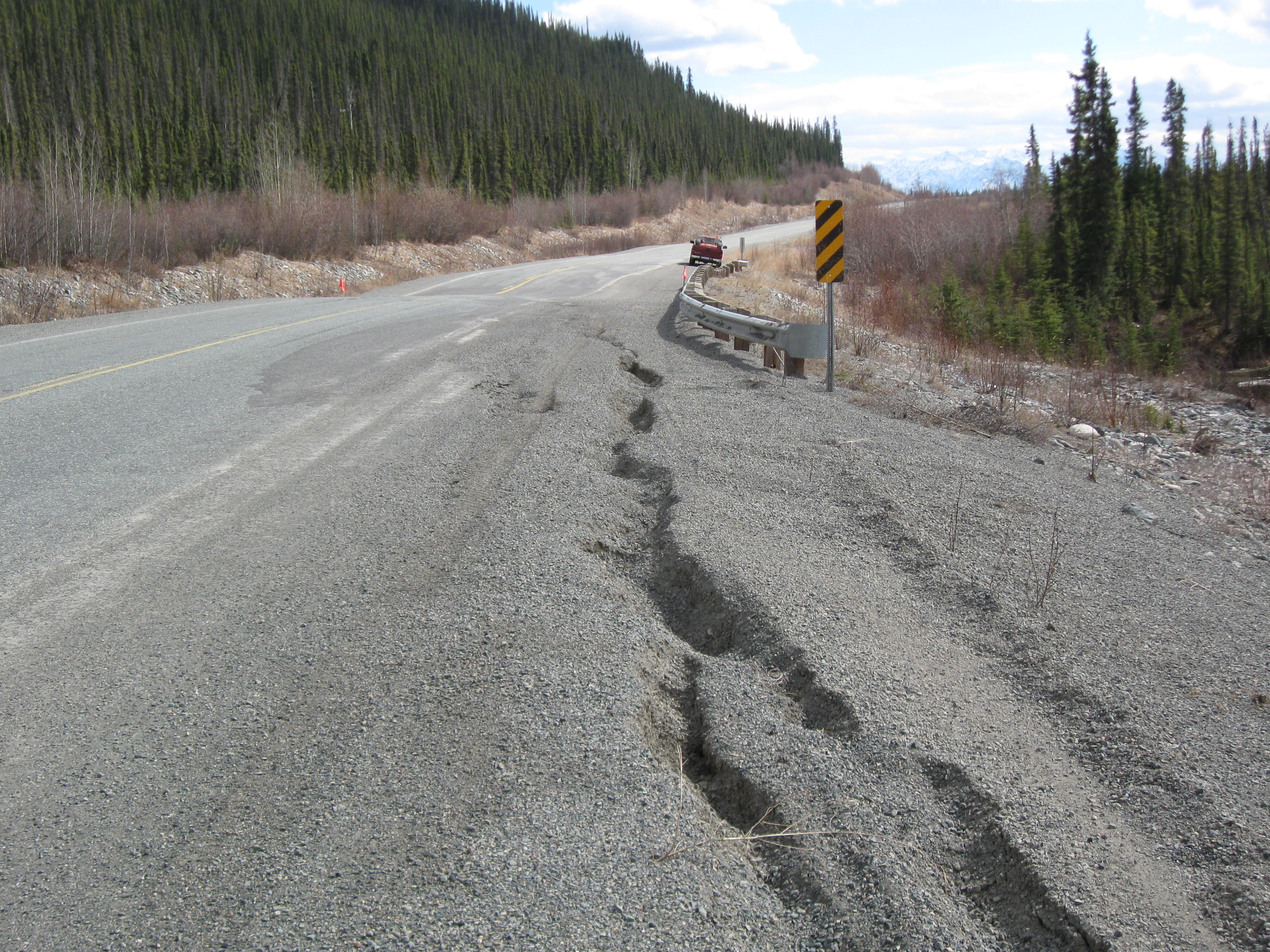 Cracking highway shoulders on the Alaska Highway.
