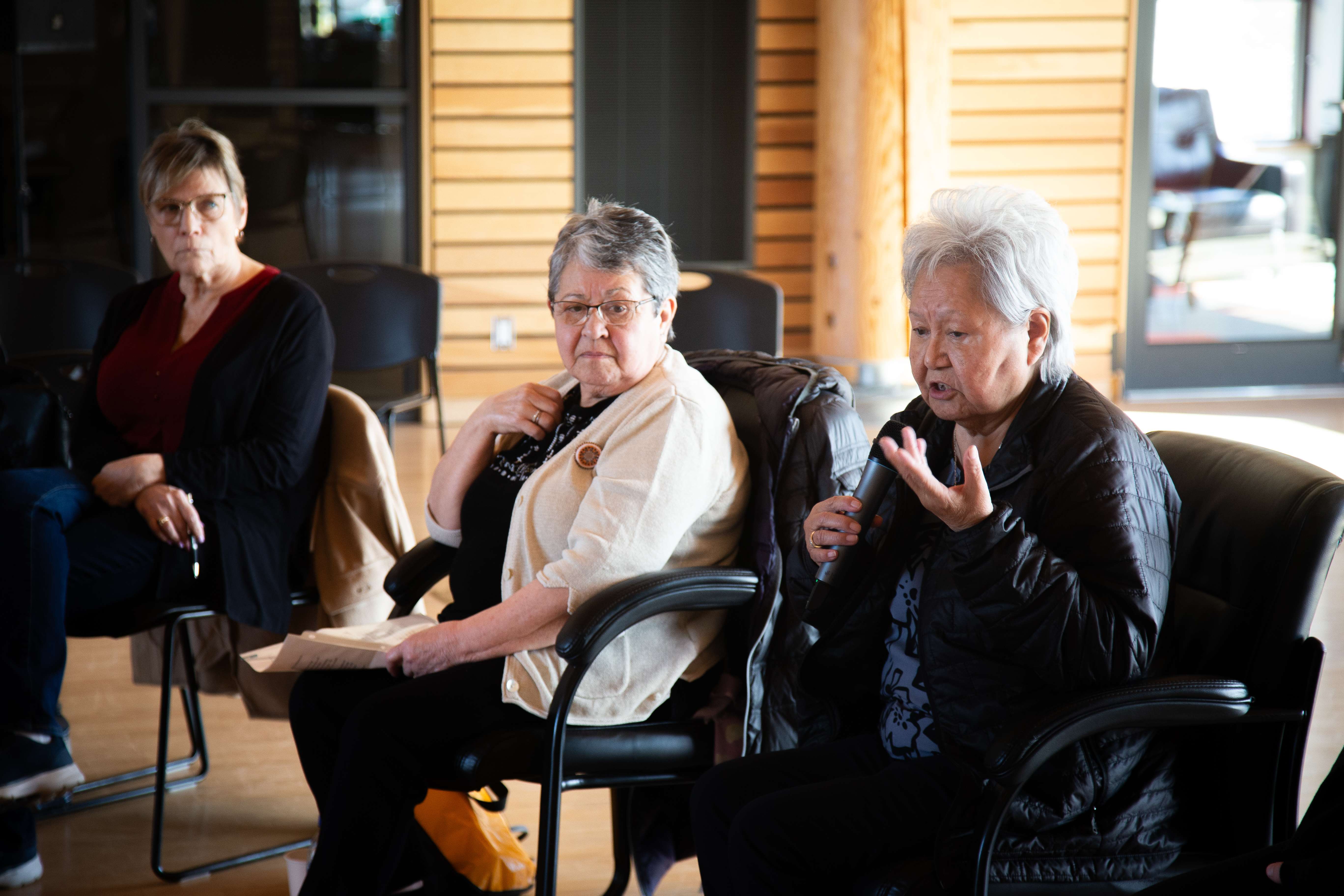 Project Manager Deborah Dupont, former Chair, Adeline Webber, and current Chair Judy Gingell of the Yukon Residential Schools and Missing Children Project speak at a community meeting in Carcross.