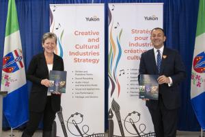 Executive Director of the Yukon First Nations Culture and Tourism Association and Minister of Economic Development, and Tourism and Culture Ranj Pillai holding copies of the new creative and cultural industries strategy. 