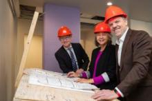 (L-R) Dr. Brendan Hanley, MP for Yukon, the Honourable Tracy-Anne McPhee, Minister of Health and Social Services of the Yukon and the Honourable Mark Holland, Canada's Minister of Health look over site plans following their announcement of a new bilateral