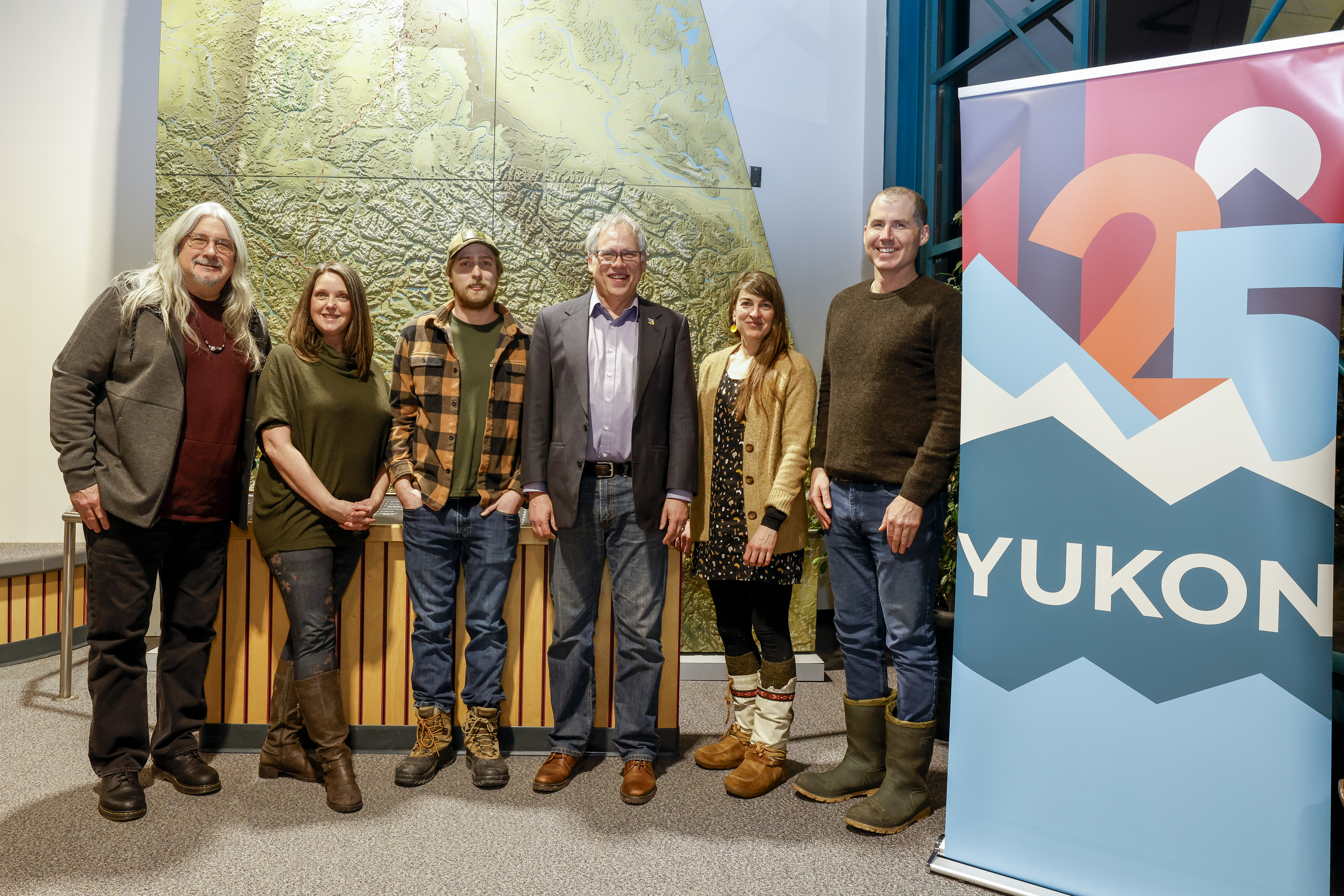Yukon 125 prize winners standing with minister of tourism and culture